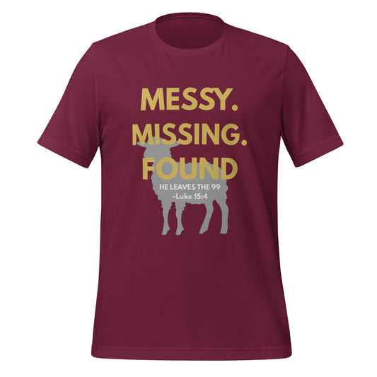 Front view of maroon Christian t-shirt with “Messy. Missing. Found.” in bold yellow text over a lamb silhouette and “He leaves the 99 – Luke 15:4” printed underneath