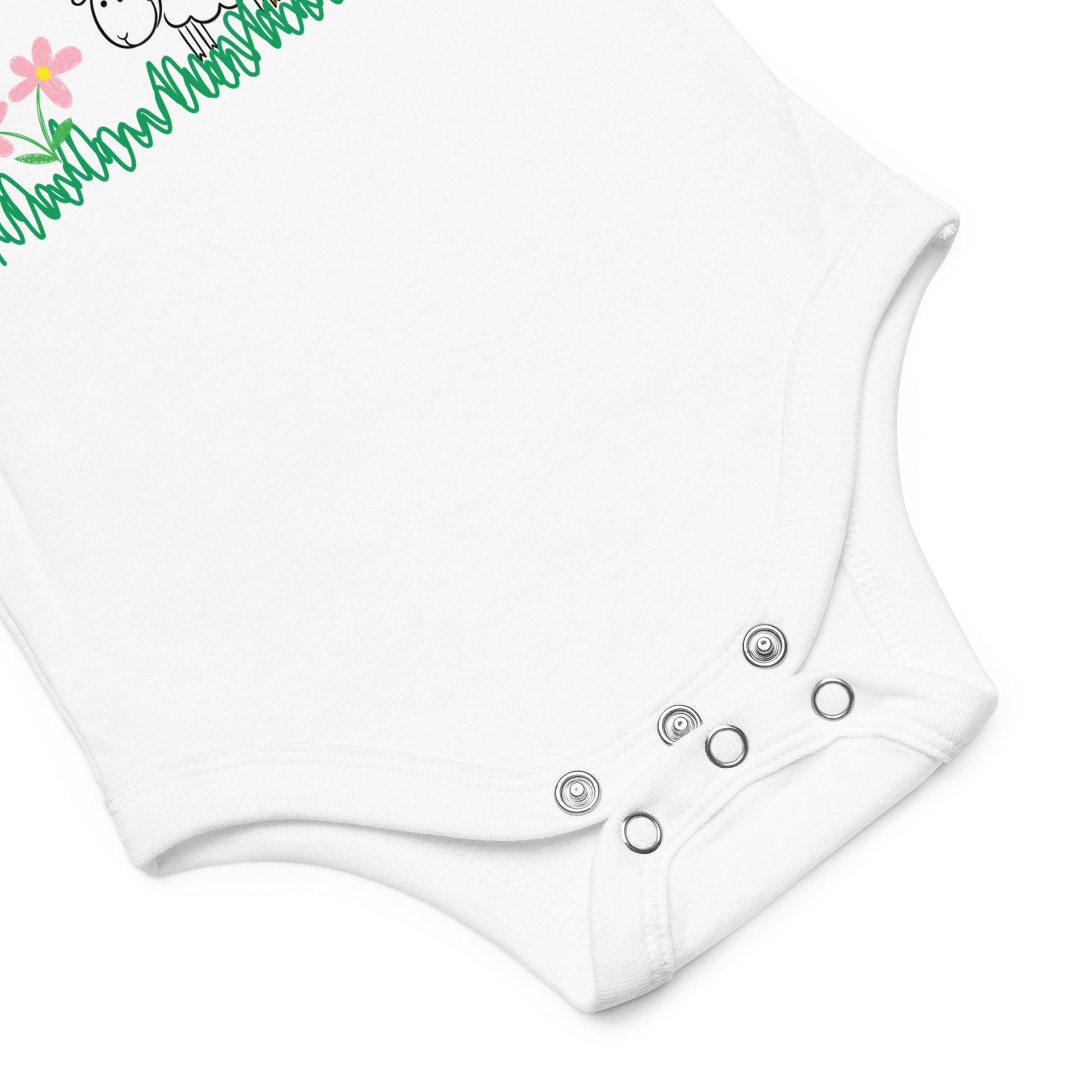 Close-up of the baby onesie’s snap closures at the bottom, highlighting reinforced stitching and soft cotton fabric.