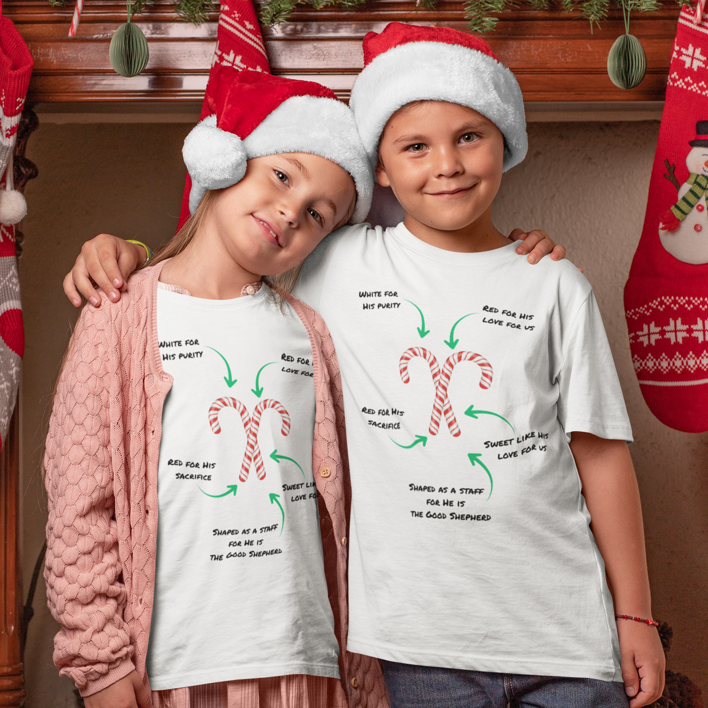 Two children wearing Christmas-themed t-shirts with candy cane  gospel in a festive setting.