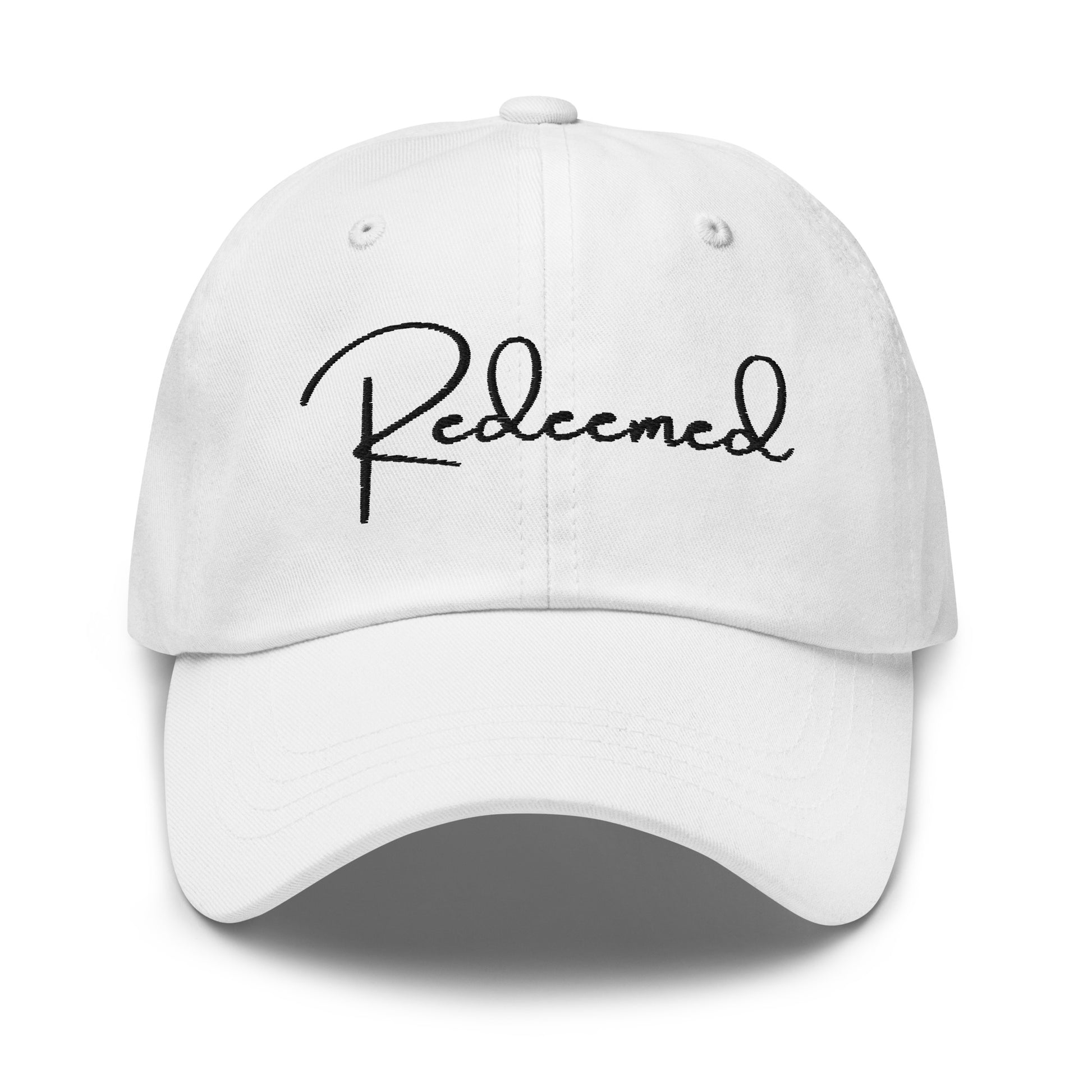 Front view of white dad hat with 'Redeemed' embroidered in black script