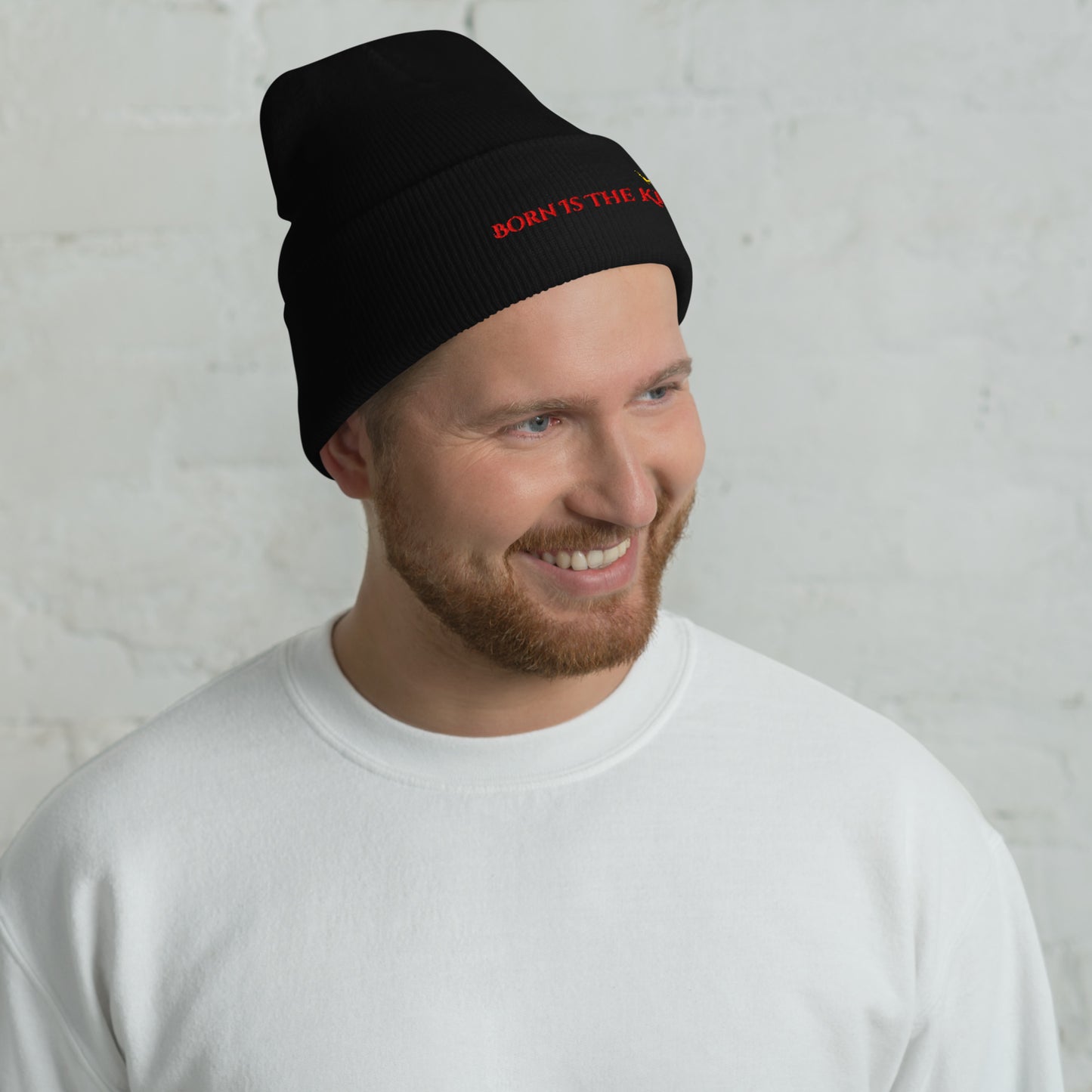 Male lifestyle image wearing Born Is the King black beanie