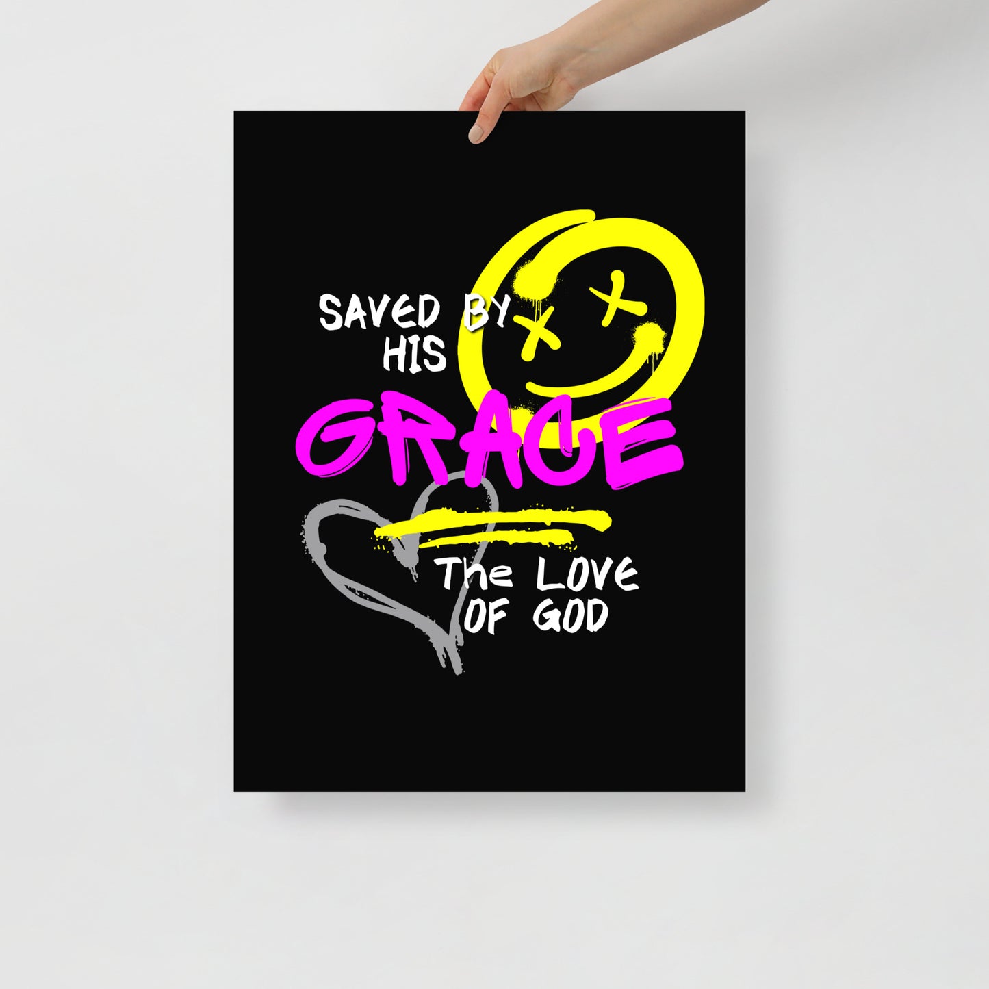 Person holding 18x24 Saved by Grace Christian poster, unframed, with street-inspired graffiti design and faith-based message
