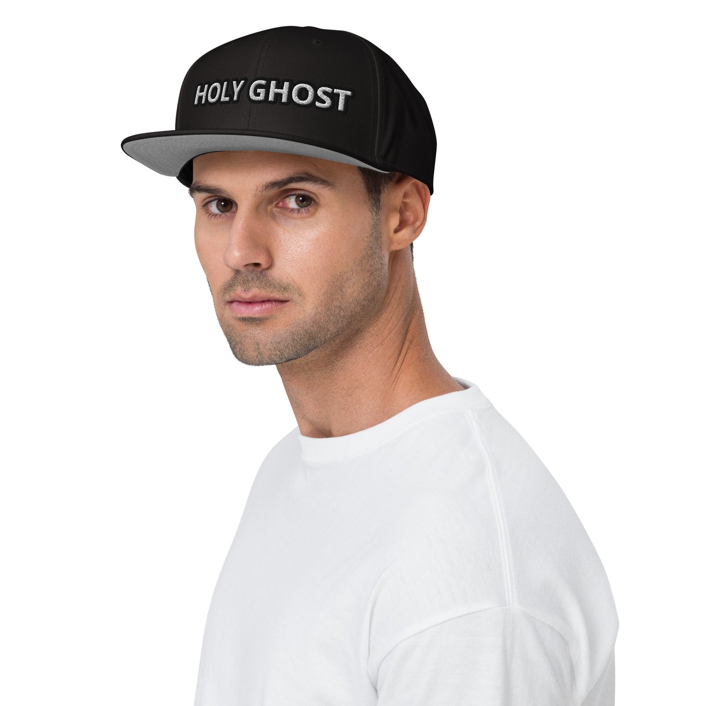 Man wearing a black cap with 'HOLY GHOST' text christian streetwear