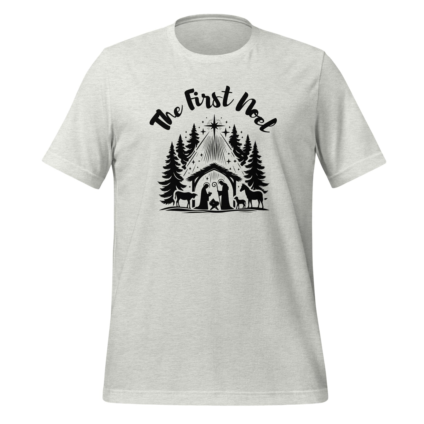 Front view of the Ash Gray First Noel Tee with black text across the chest and a nativity graphic below, including the manger, pine trees, and Christmas star.

