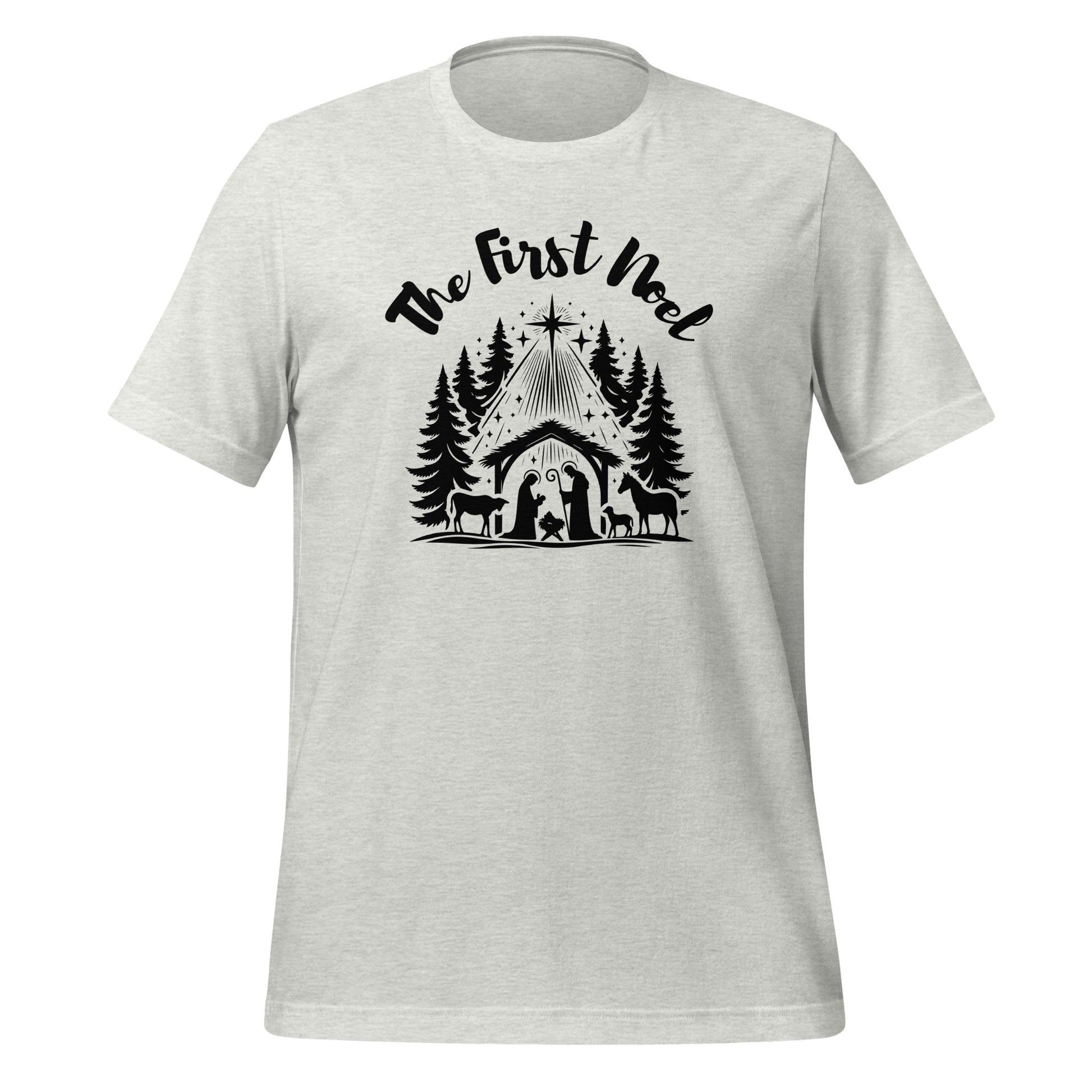 Front view of the Ash Gray First Noel Tee with black text across the chest and a nativity graphic below, including the manger, pine trees, and Christmas star.
