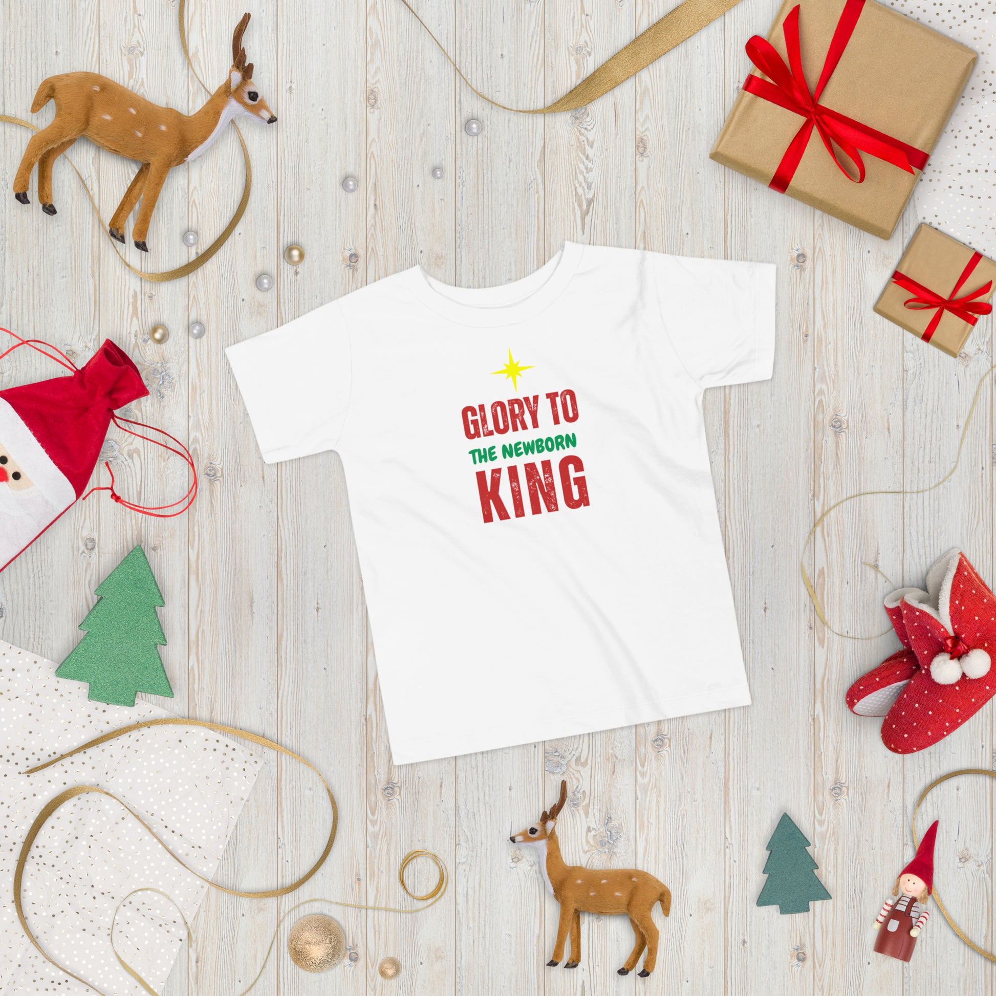 Glory to the Newborn King Christmas Tee with cranberry and green lettering and star above – Christian Christmas shirt by Always Faithful.
