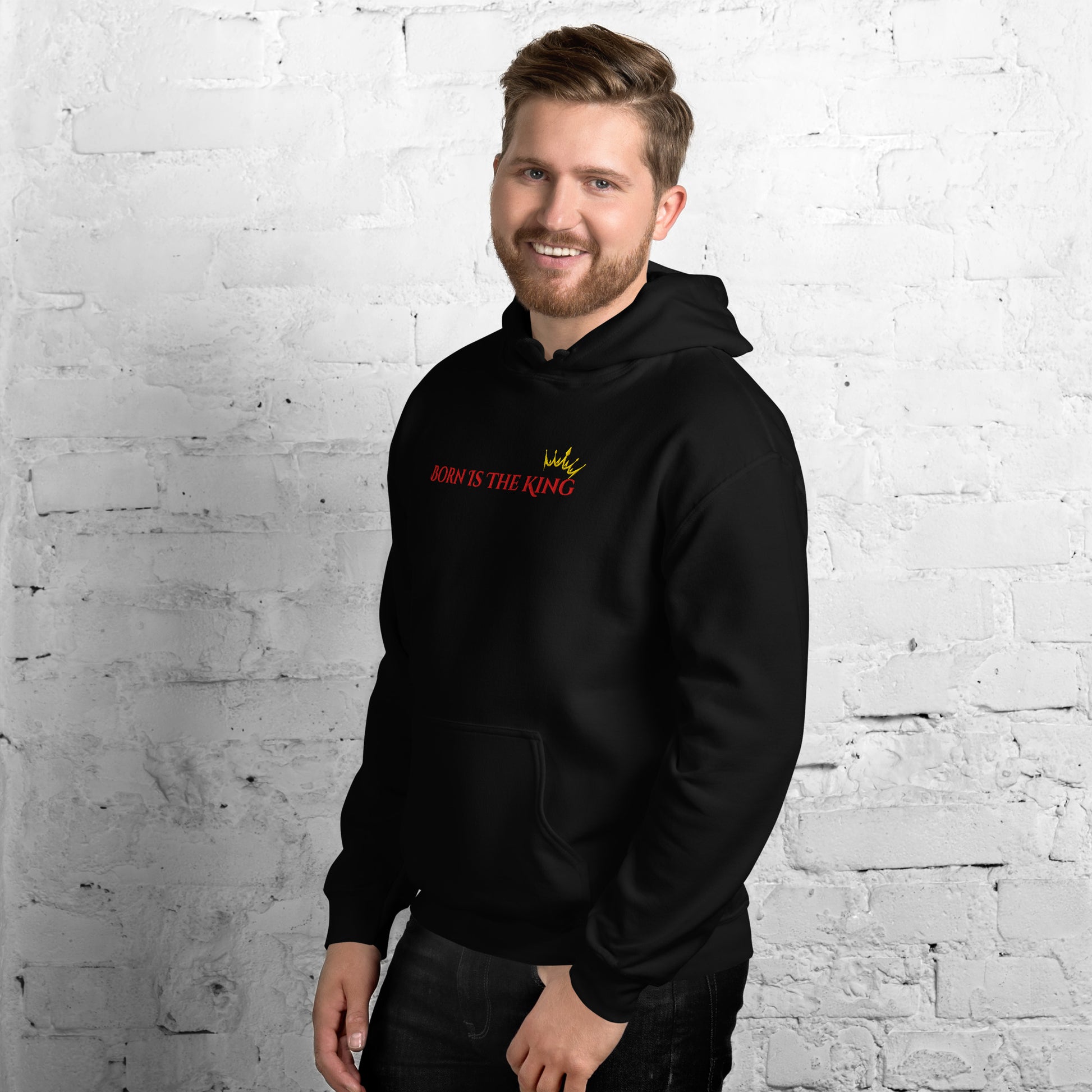man wearing Born Is The King Christian hoodie front view