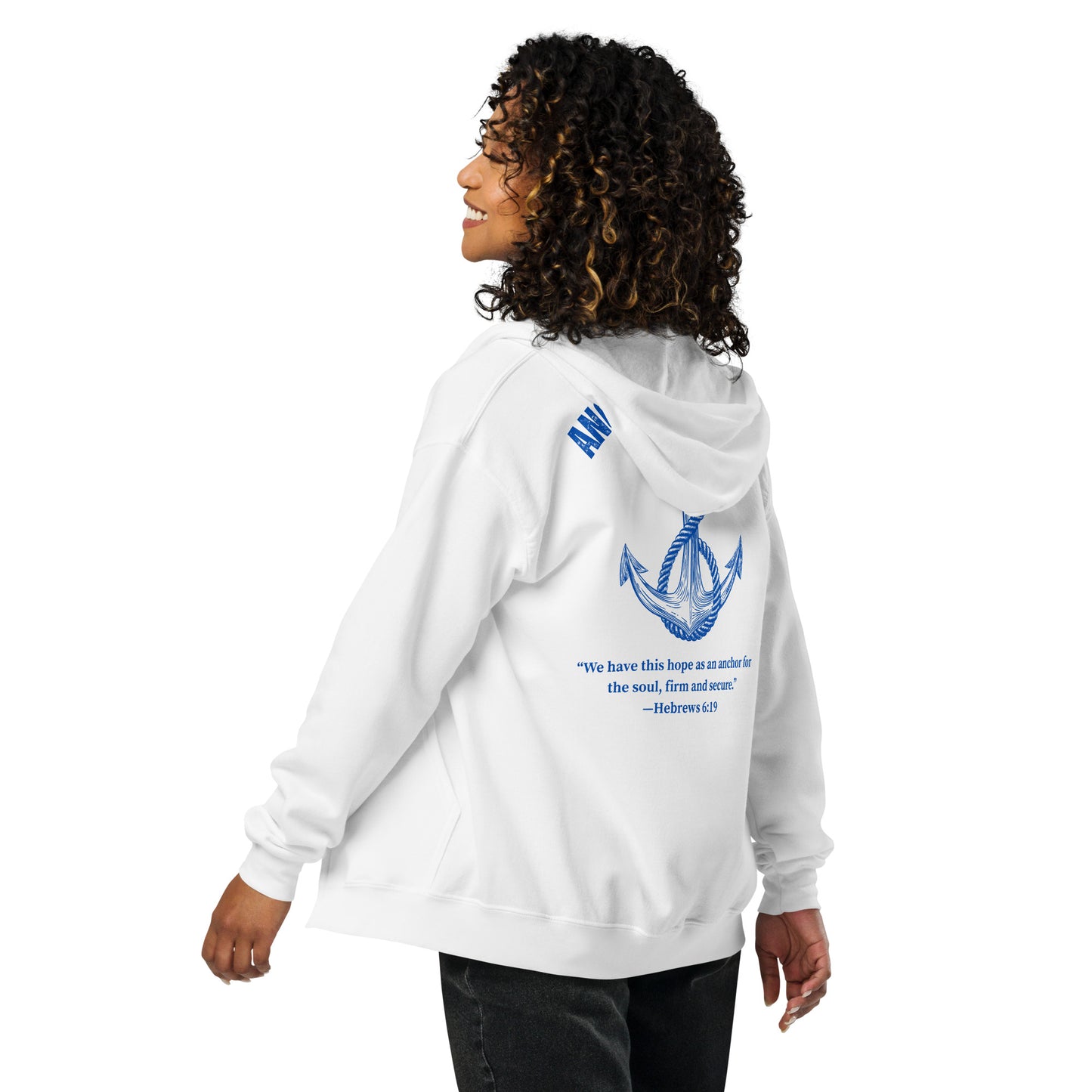 Young woman wearing the white full zip hoodie, shown from an angled back view to display the large anchor graphic and Hebrews 6:19 on the back.