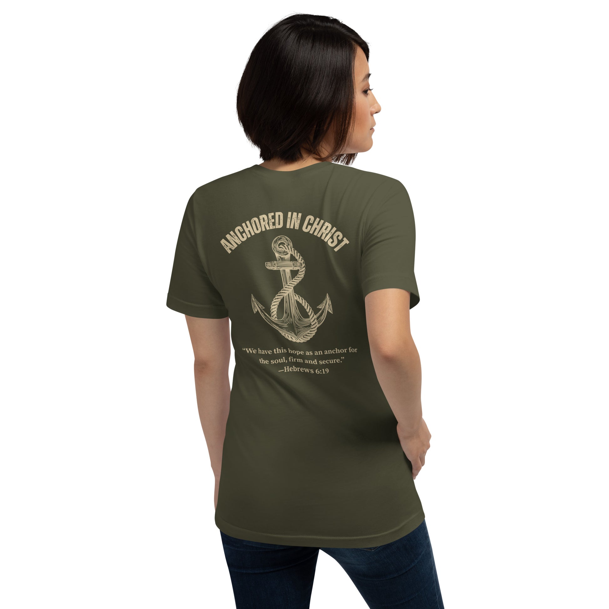 Woman wearing Anchored in Christ Field Edition shirt, back view showing anchored in Christ military green design on back