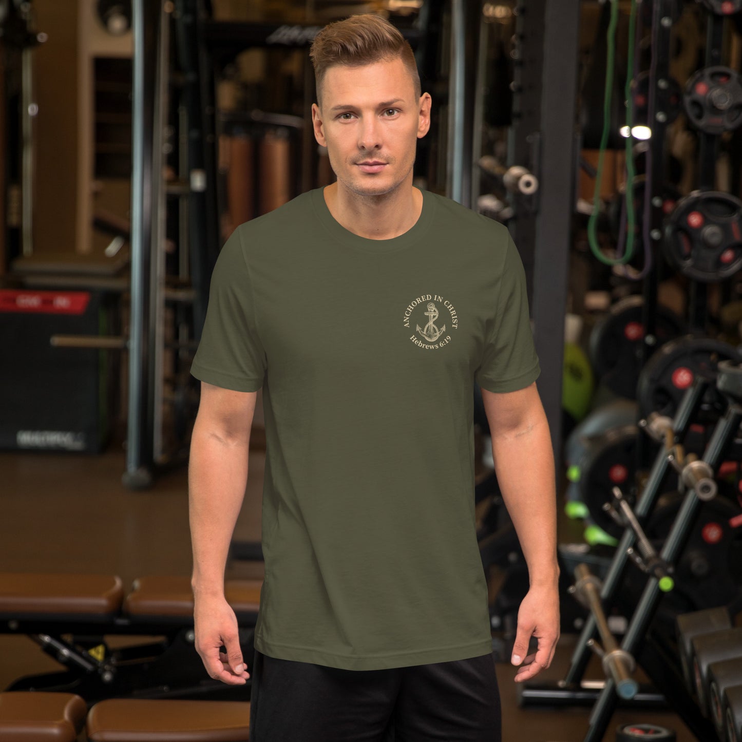 Man wearing Anchored in Christ Field Edition shirt, front view in military green with creamy tan print