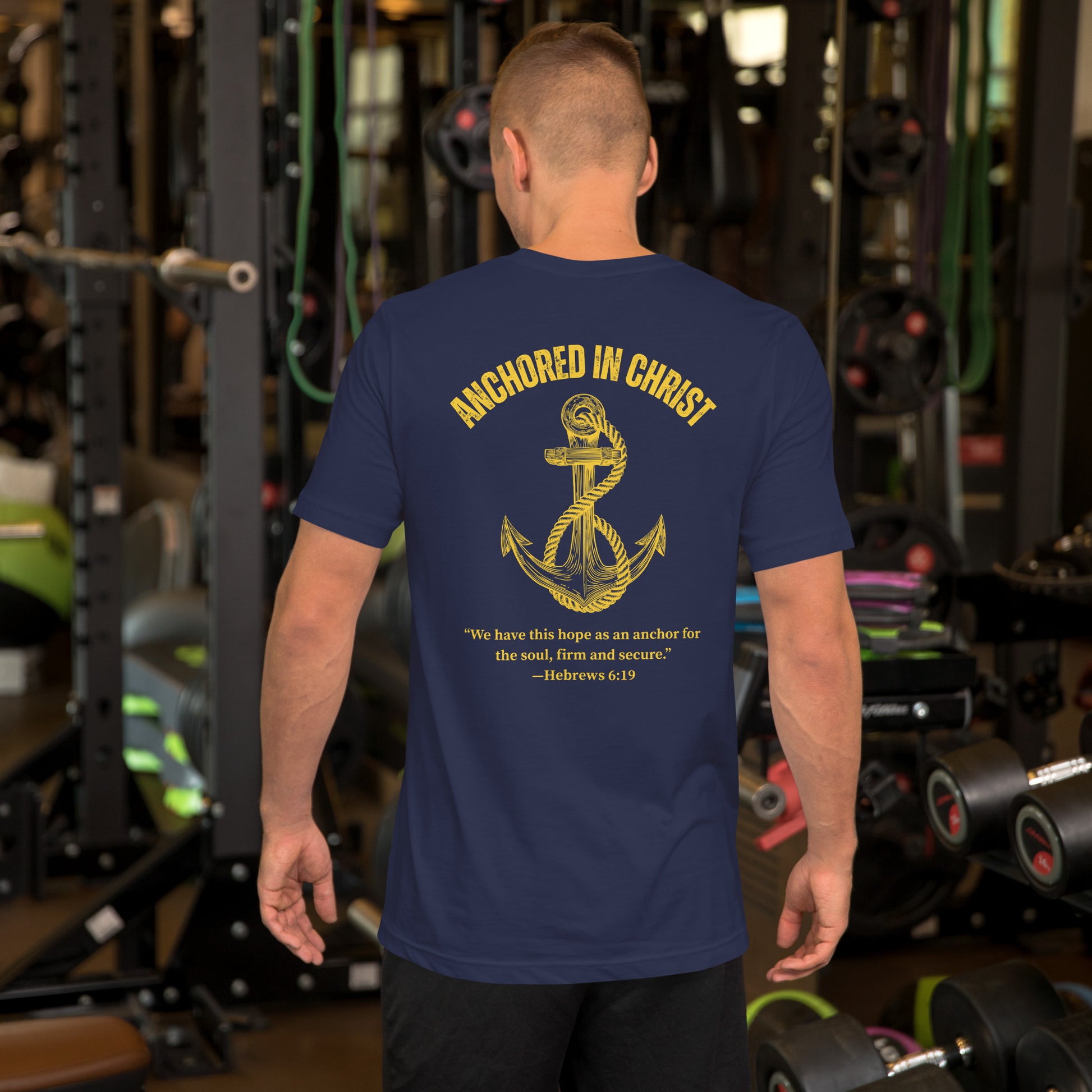 Male model lifestyle photo, back view wearing the Anchored in Christ – Deep Waters Edition tee.