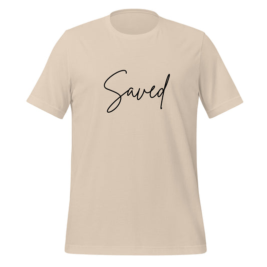 Front view of soft cream Christian t-shirt with “Saved” in minimalist pink script across the chest
