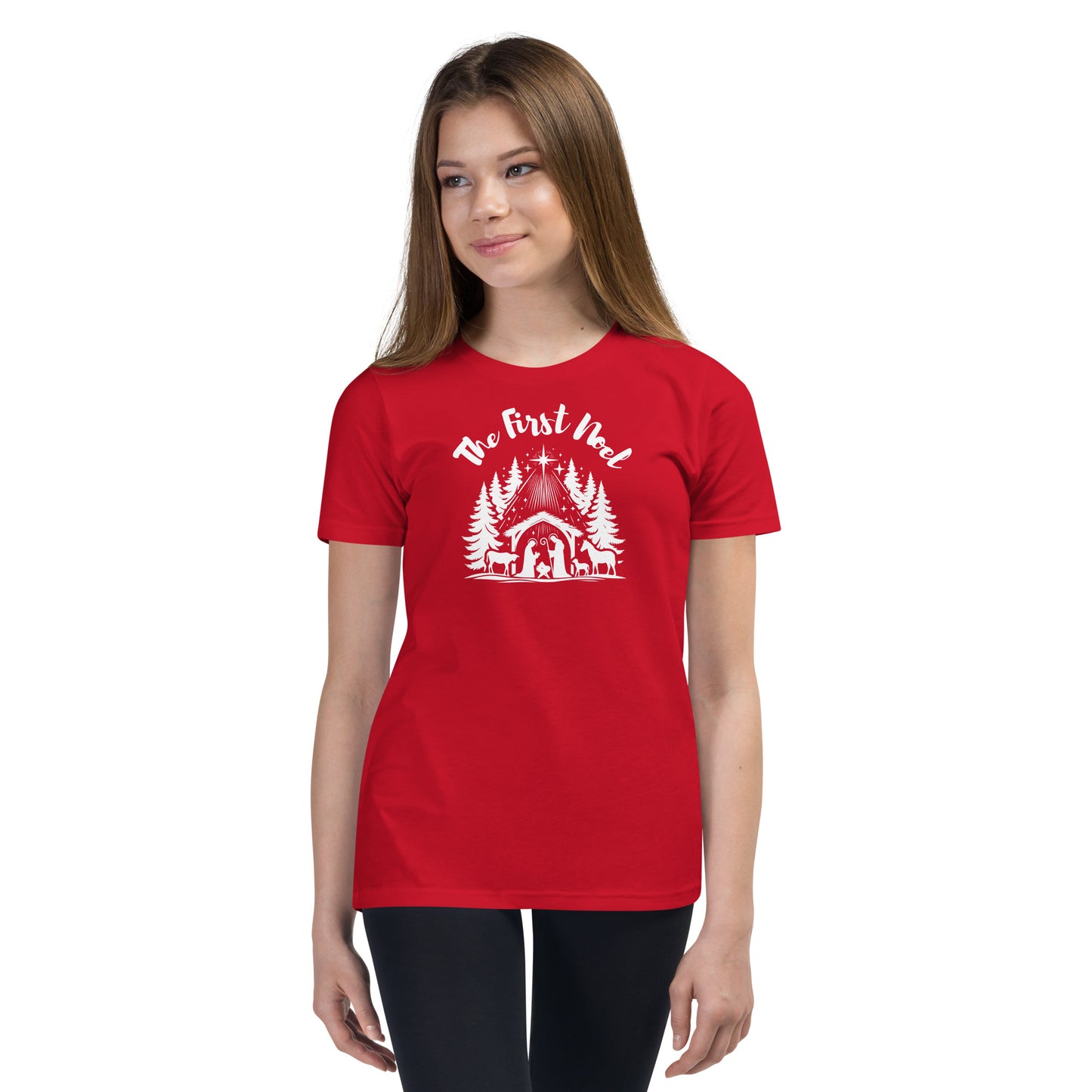 Youth red Christian Christmas tee with white nativity design and The First Noel text inspired by Luke 2:11.
