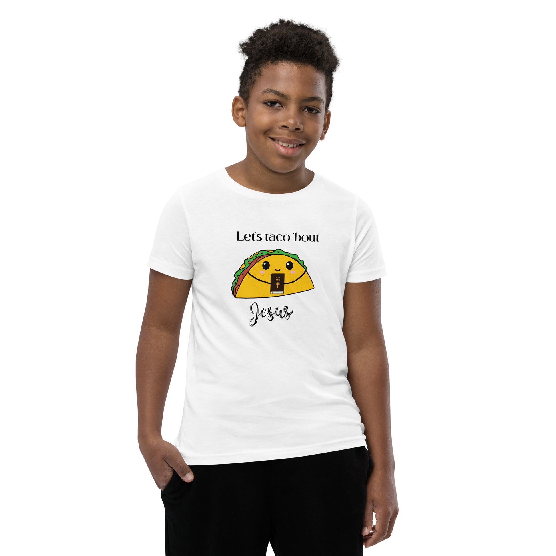 Boy wearing Let’s Taco ’Bout Jesus kids t-shirt – fun Christian youth shirt with taco Bible graphic, front view
