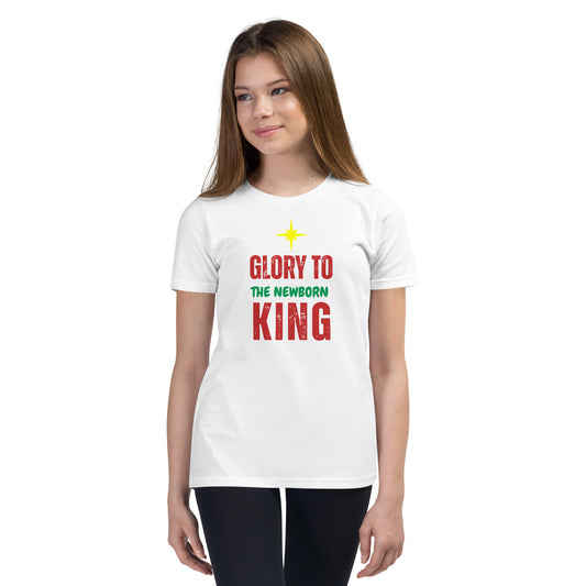 Youth wearing Glory to the Newborn King Christmas Tee with cranberry and green lettering and star above – Christian Christmas shirt by Always Faithful.
