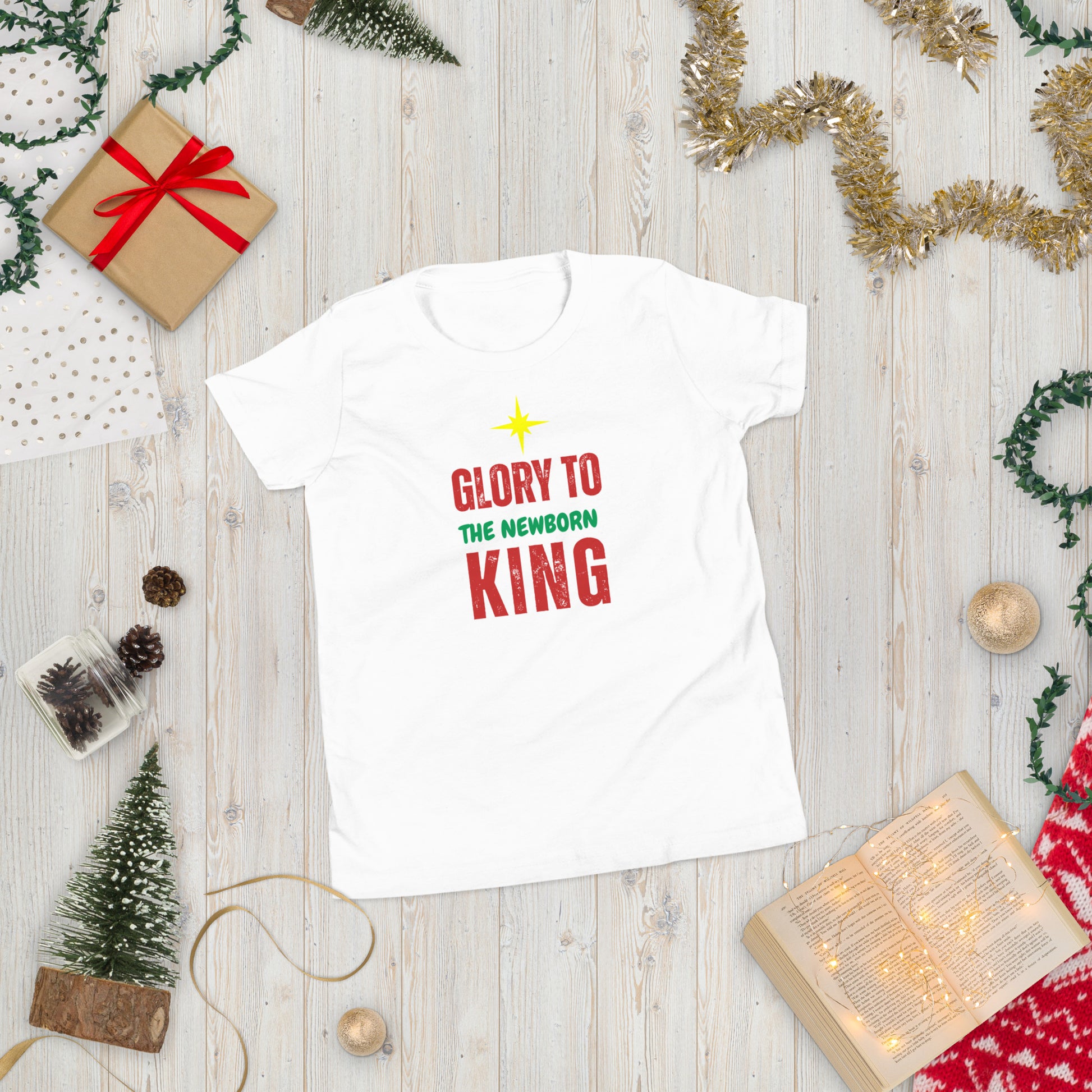 Glory to the Newborn King Christmas Tee with cranberry and green lettering and star above – Christian Christmas shirt by Always Faithful.
